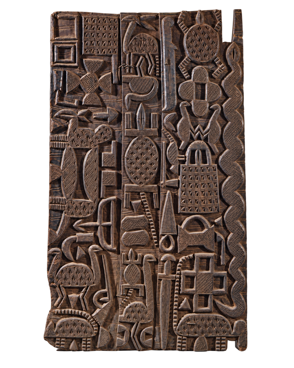 Detail of a dark panel carved with geometric forms